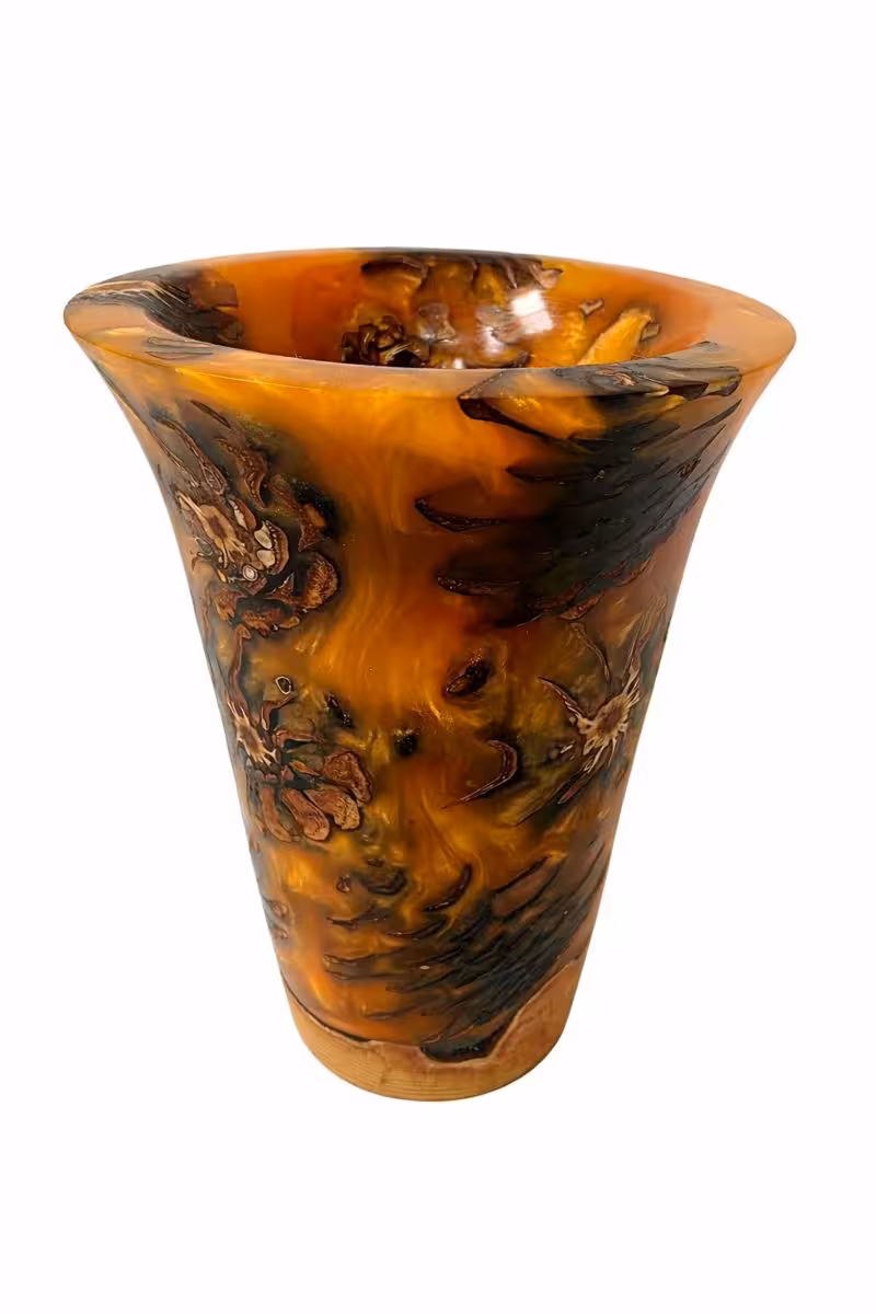 Orange vase with pine cones